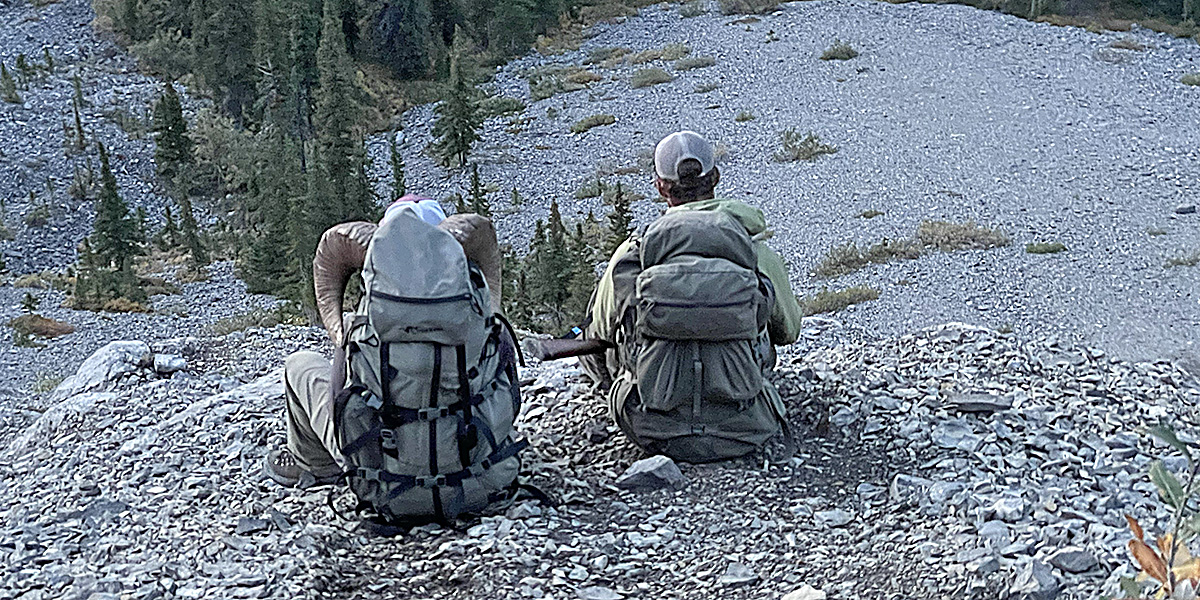 Successful sheep hunters taking a breather on their way out.