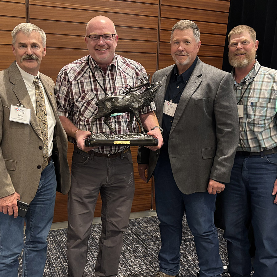 Daryl Lutz receiving the Phillip W. Schneider Lifetime Achievement Award from WAFWA