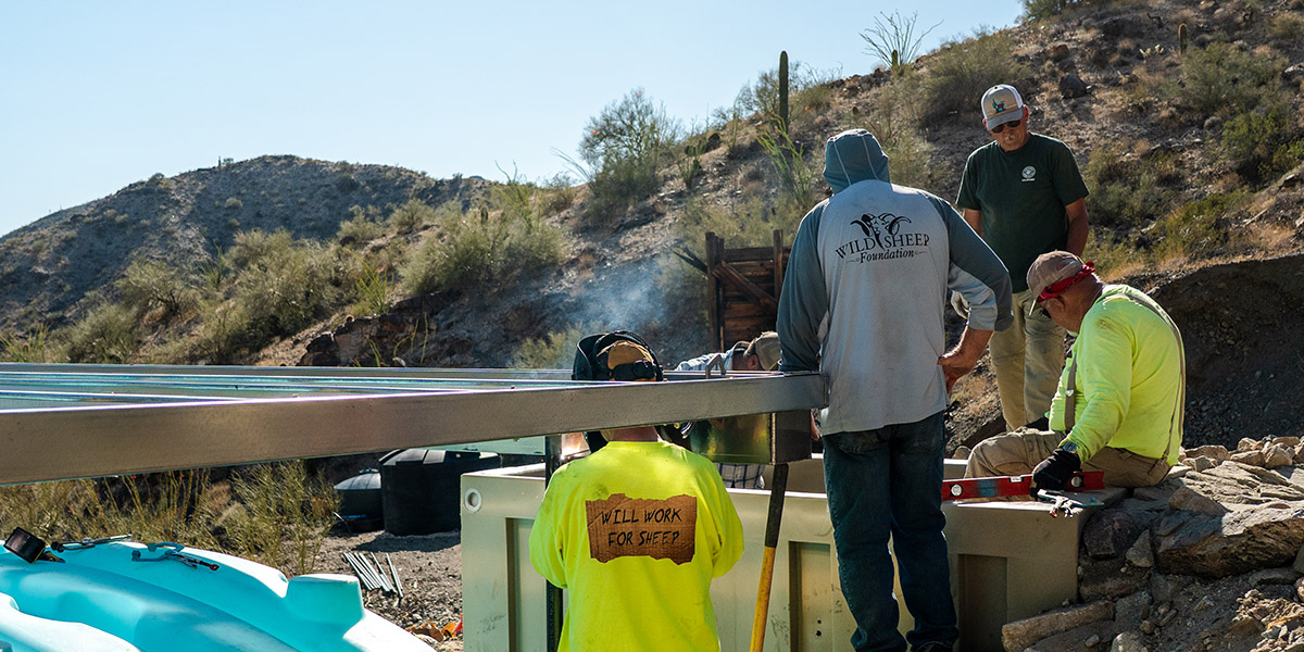 Volunteers installing a water guzzler in Arizona's Harcuvar Mountains Volunteers installing a water guzzler in Arizona's Harcuvar Mountains