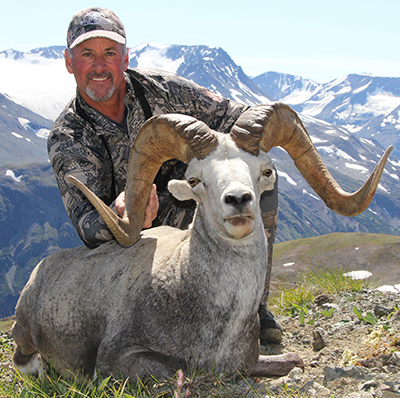 Gray Thorton with sheep in the field