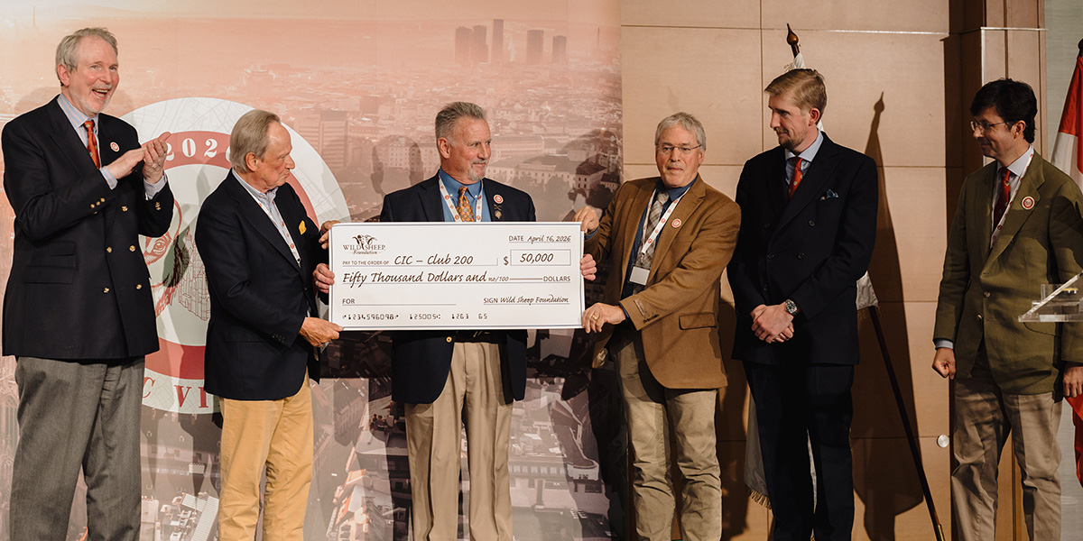 Gray Thornton and Kurt Alt present a check for $50,000 to CIC