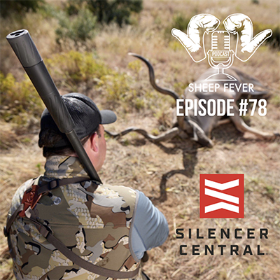 Man holding a rifle with a silencer