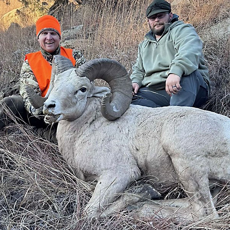 Elated hunter with the Badlands ram known as the White Whale