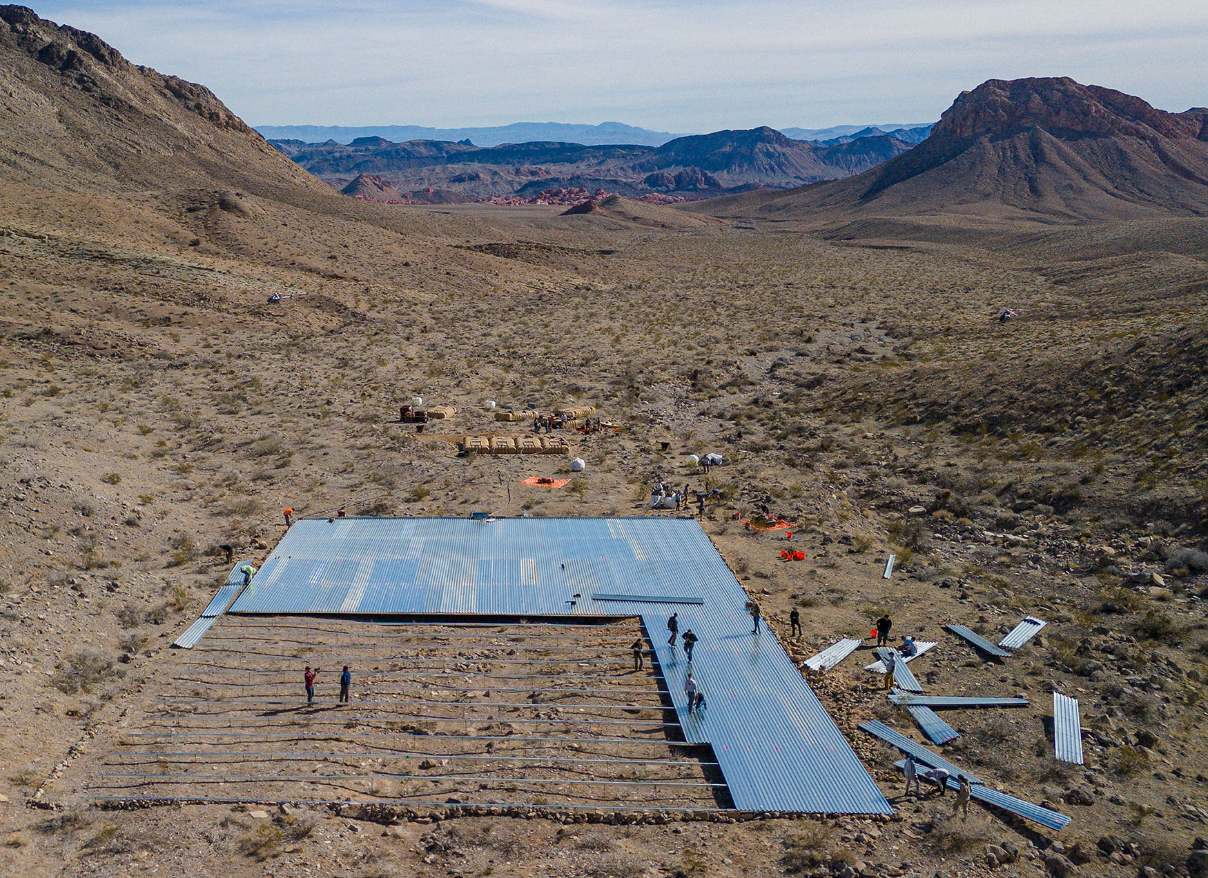 Volunteers work on the installation of a massive water guzzler in Nevada's Muddy Mountains.