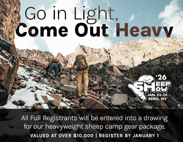 Two hunters hiking up a steep ravine