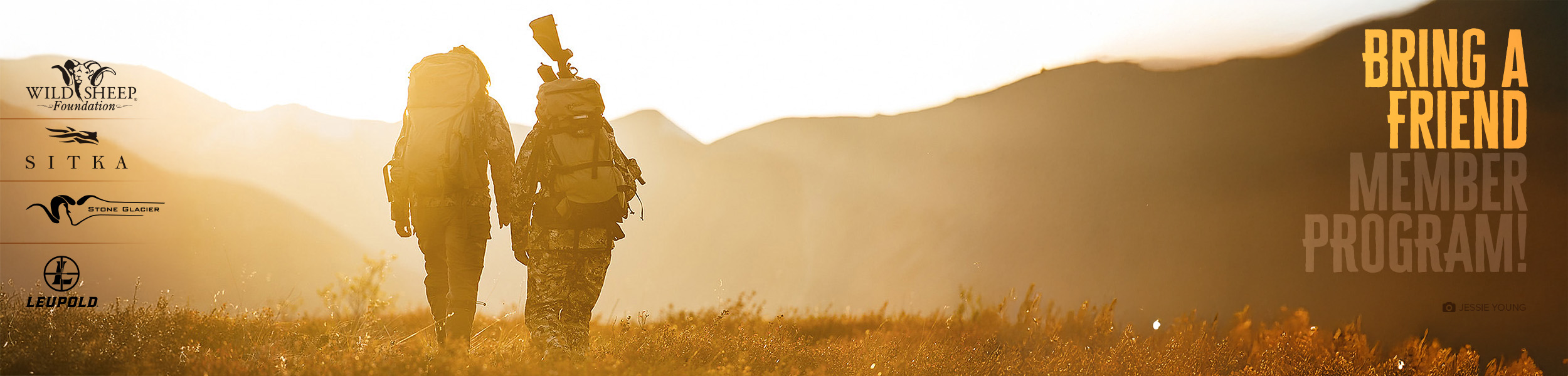 Two hunters walking in the golden light