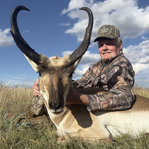 Hunter with a New Mexico pronghorn blue skies