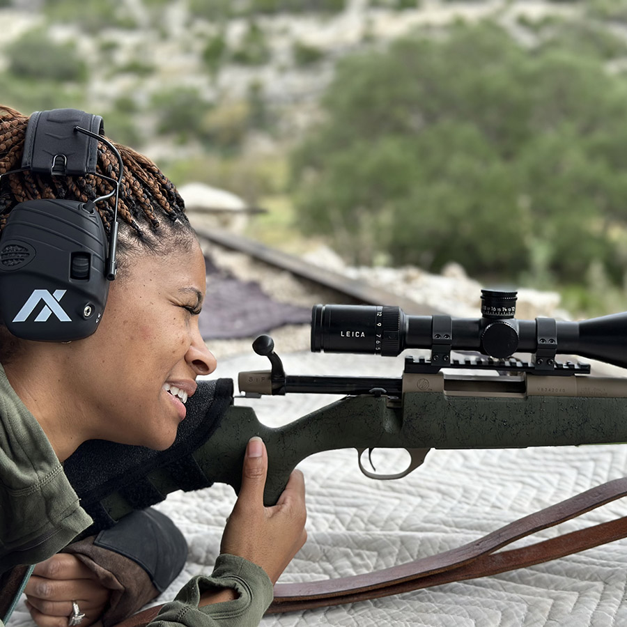 Woman learning how to shoot a rifle